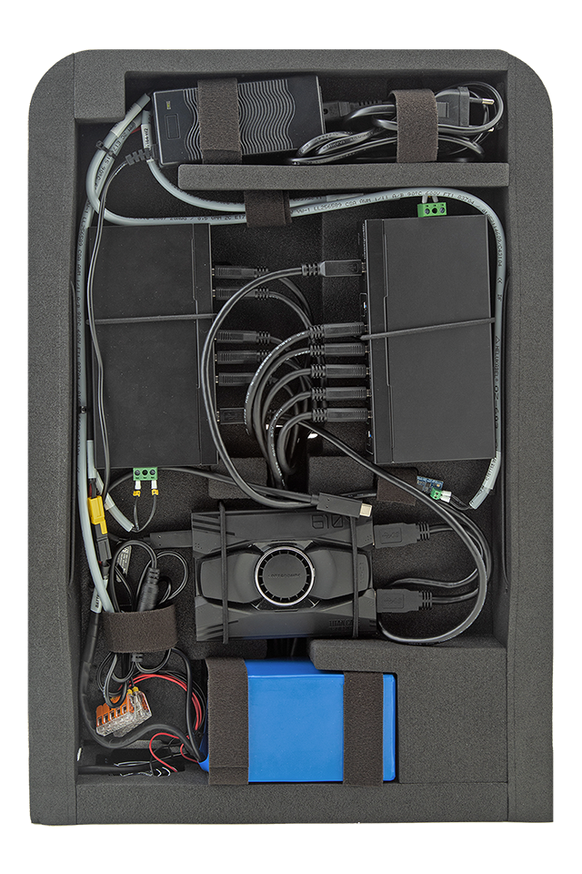 Echo Trek II device frame depicted from the backside with USB hubs, a mini controlled PC, a battery and a charger in their placeholders.